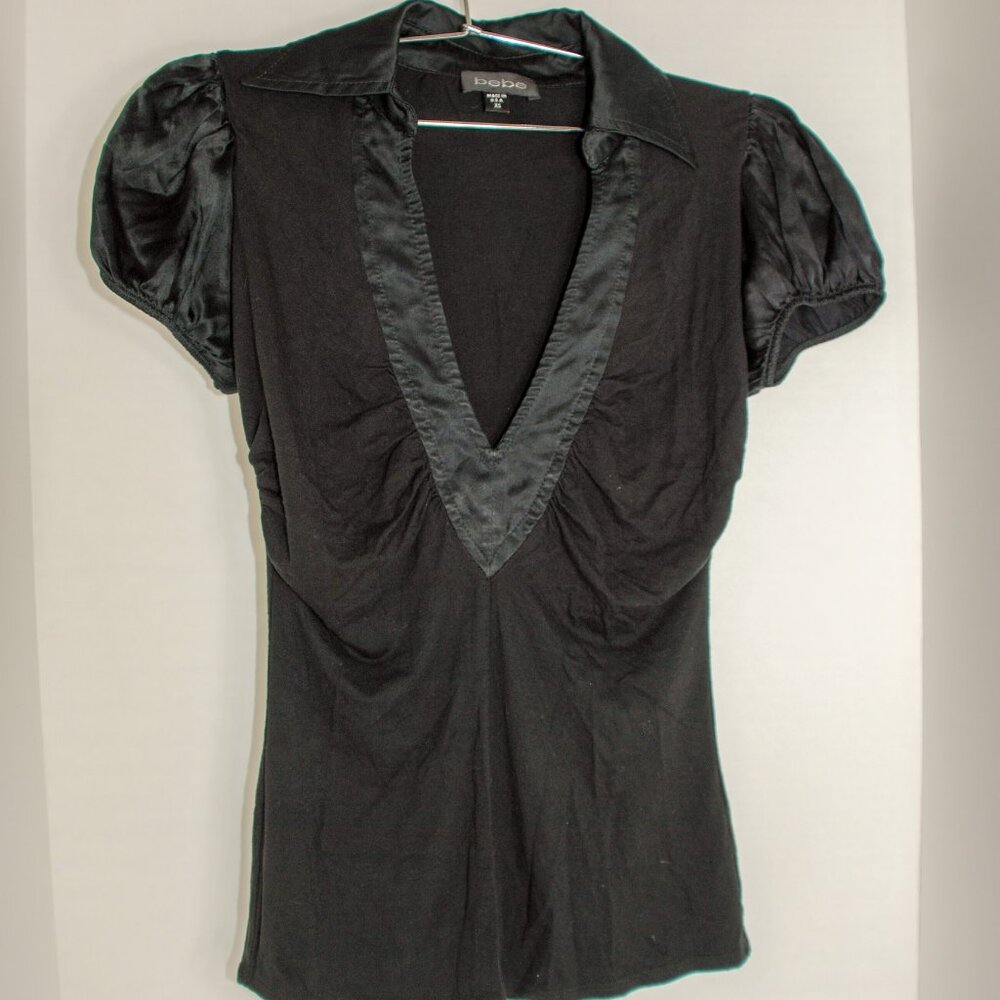 Black bebe V-neck top with a collar and short sleeves size small.